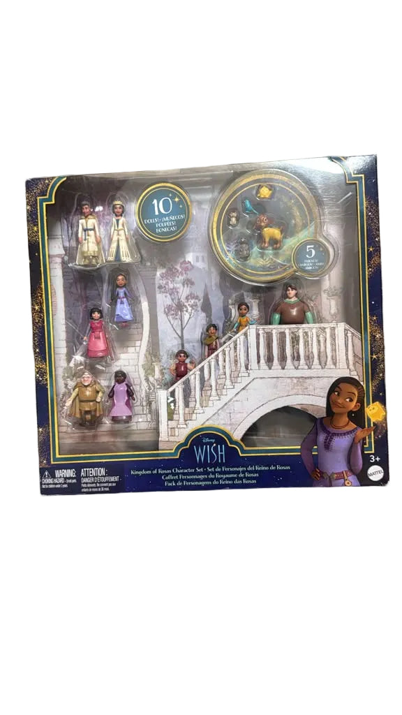 Disney Wish 10-piece toy set in its original packaging, placed on a brown wooden floor. The set includes various character figurines, a golden medallion, and a white staircase.
